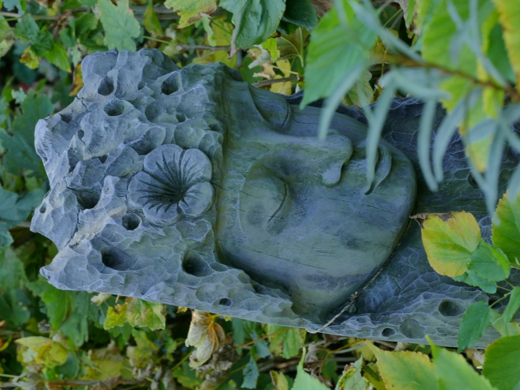 Eyebright, Buddha Gesicht im Holz